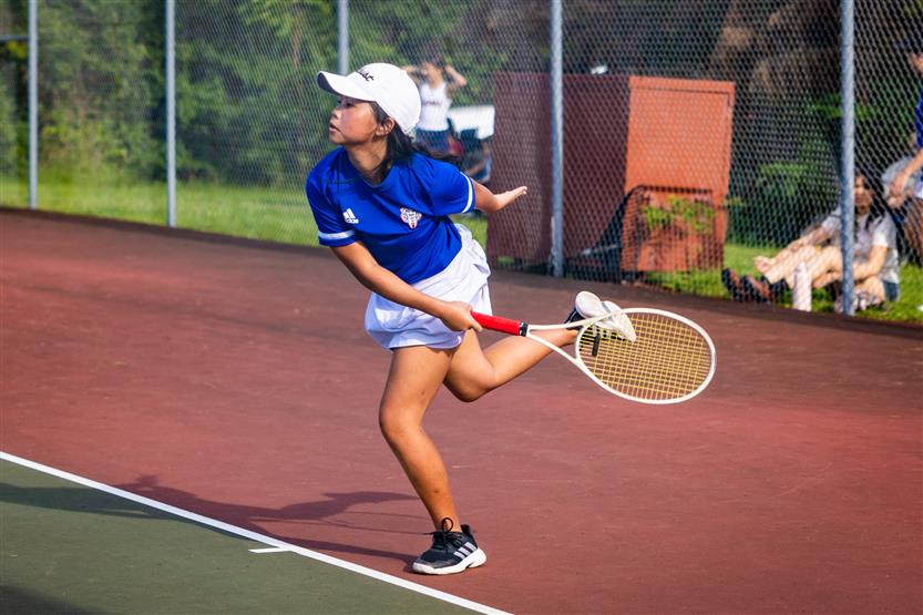 Students play tennis